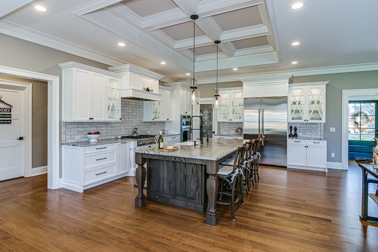 The kitchen is part of the open floor plan and melds seamlessly with the adjacent dining area and living room